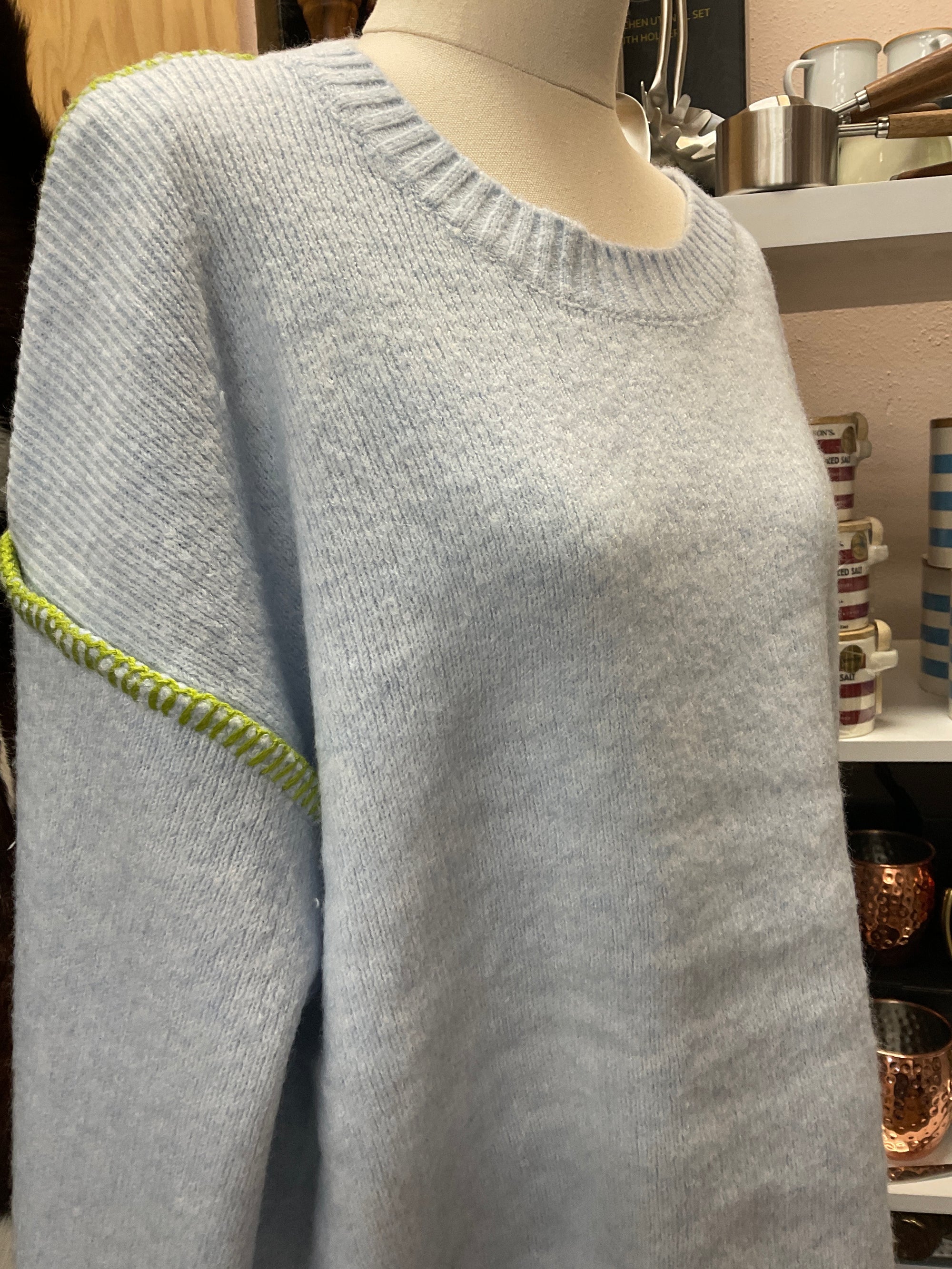 Blue knit with green stitching