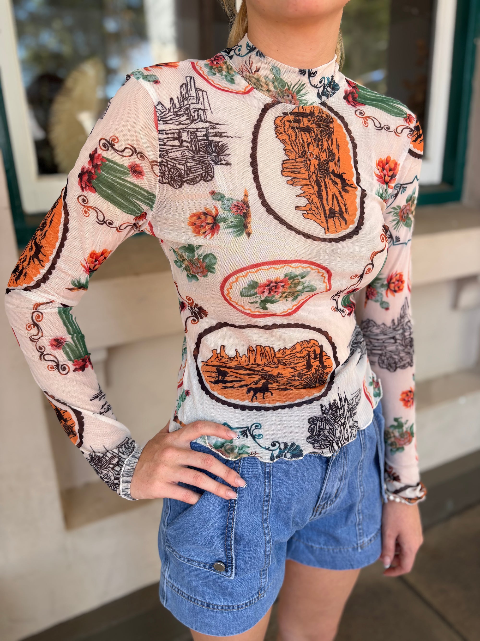 33147T Western Motif Mesh Mock Neck Top