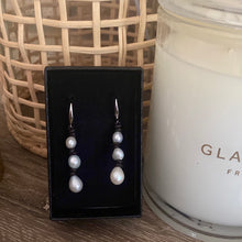 Pearl and black leather earrings